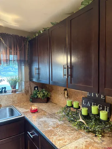 a kitchen with sink and window