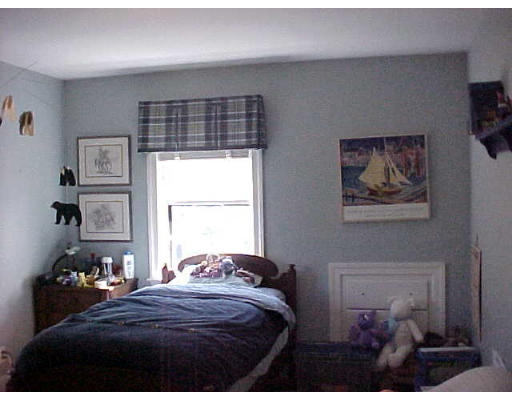 47 Palmer Road Newton, MA 02468 - Photo 5 of 8 a bedroom with a bed and a painting on the wall