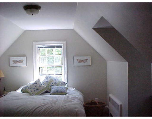 47 Palmer Road Newton, MA 02468 - Photo 7 of 8 a bedroom with a bed and a window