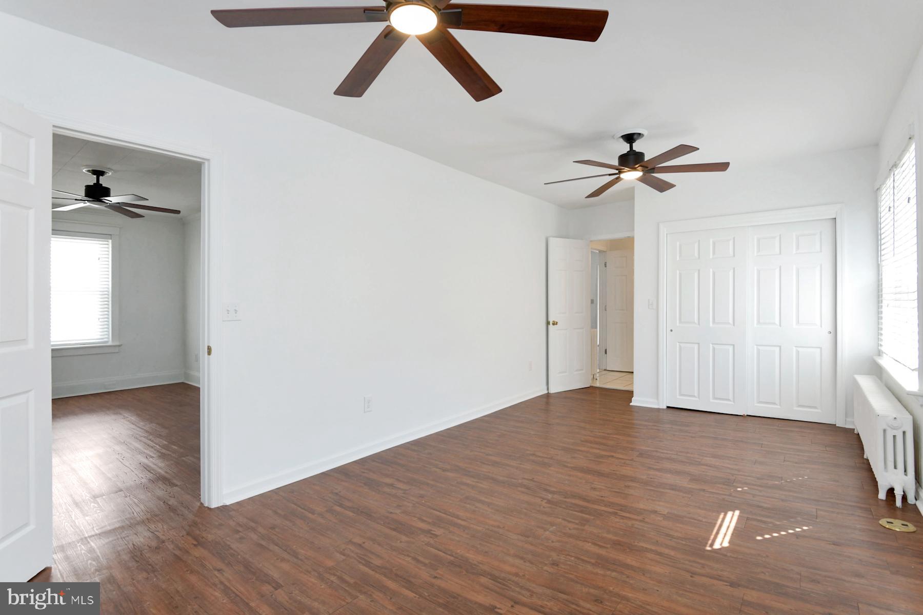 1740 Prospect Street Ewing, NJ 08638 - Photo 11 of 26 a view of empty room with wooden floor and ceiling fan
