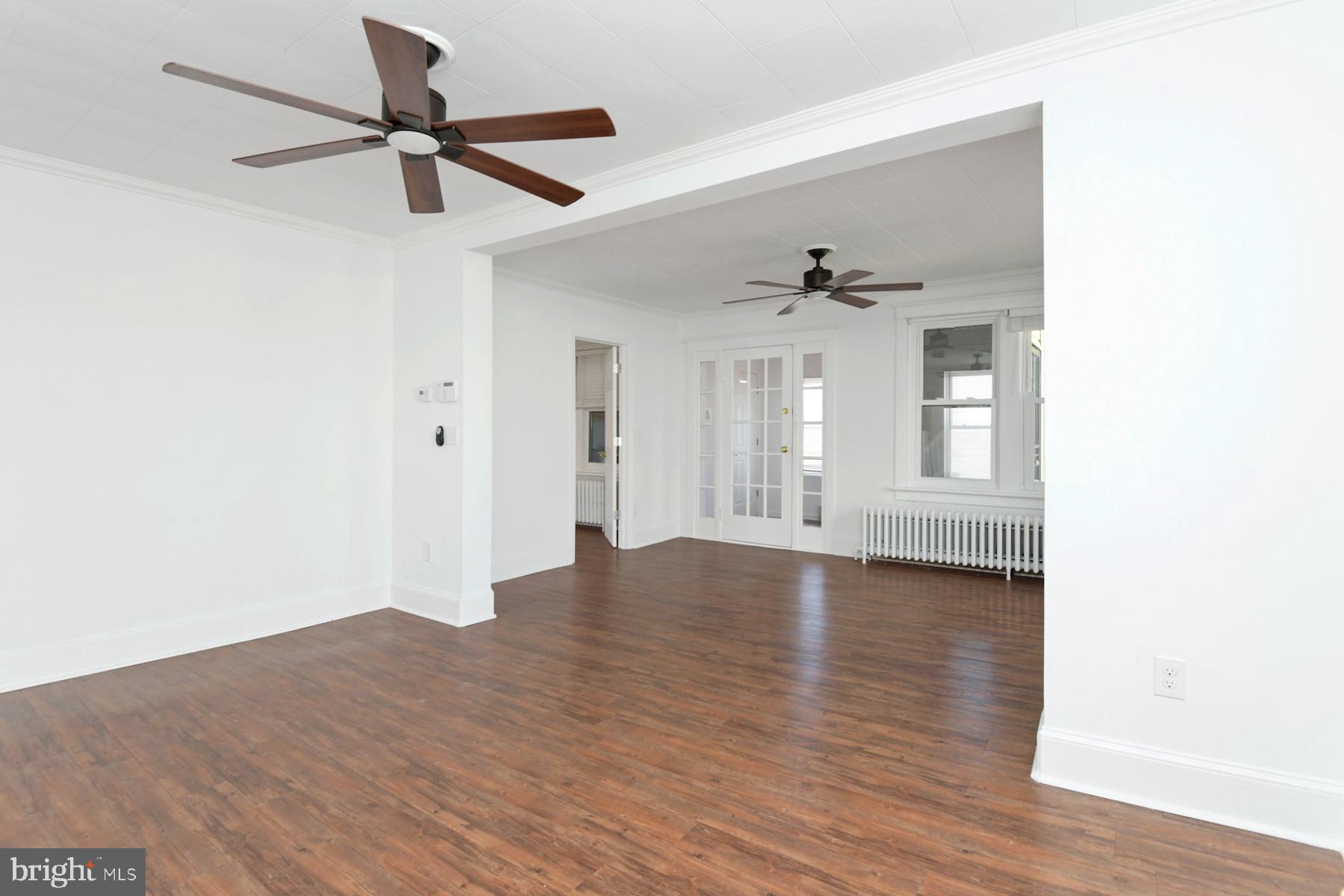 1740 Prospect Street Ewing, NJ 08638 - Photo 14 of 26 a view of an empty room with wooden floor and a window