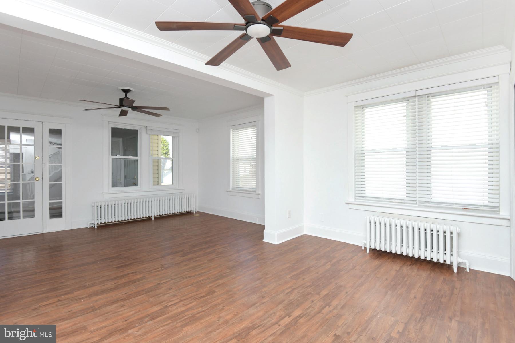 1740 Prospect Street Ewing, NJ 08638 - Photo 15 of 26 a view of an empty room with wooden floor and a window