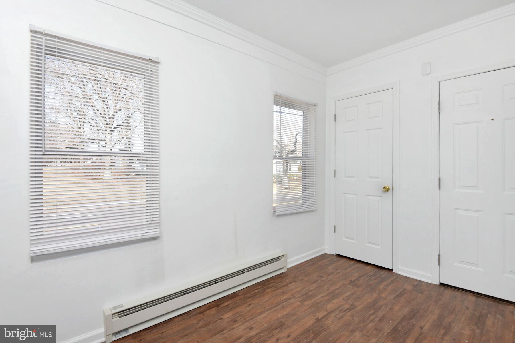 1740 Prospect Street Ewing, NJ 08638 - Photo 18 of 26 a view of an empty room with wooden floor and a window