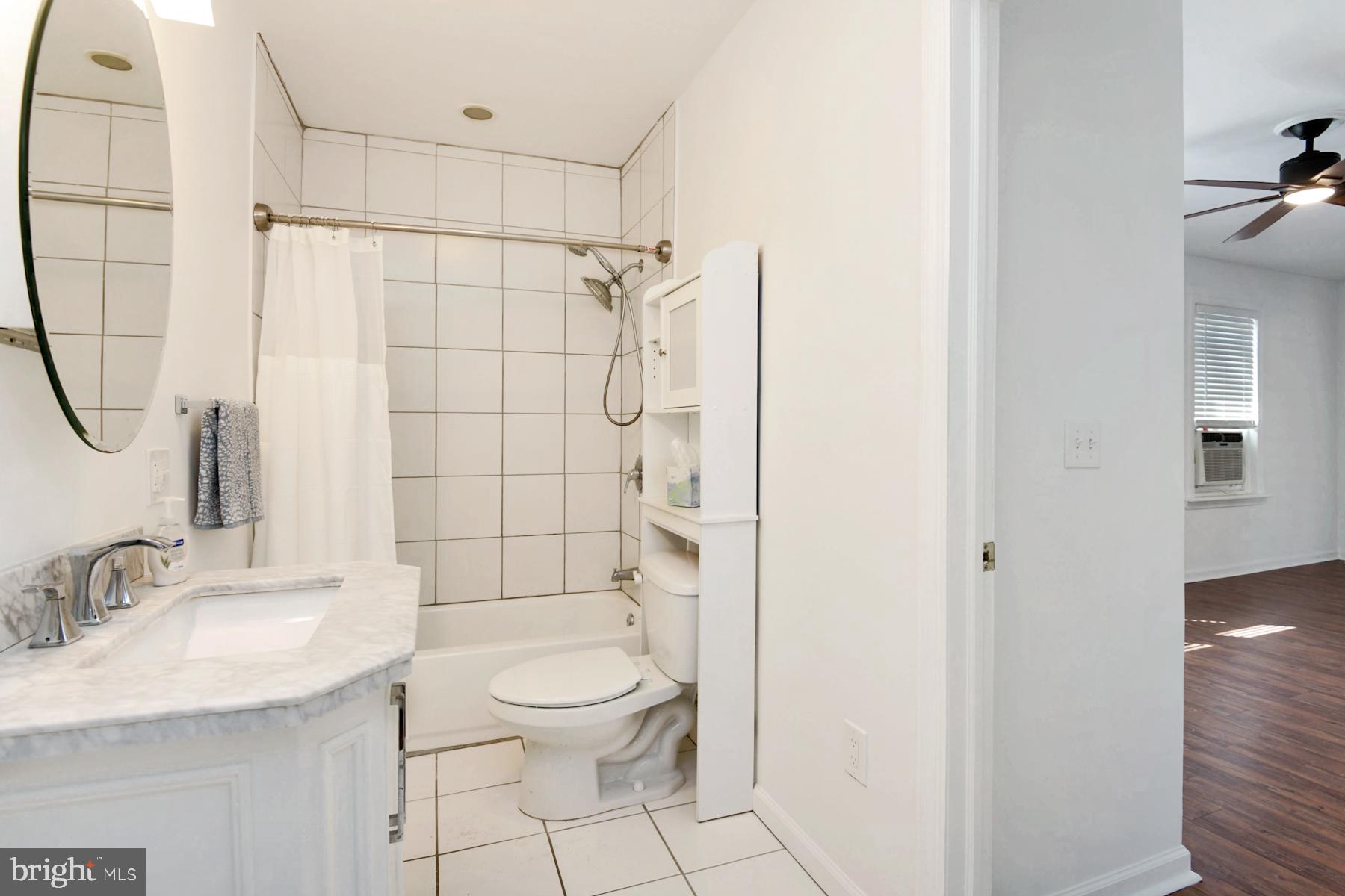 1740 Prospect Street Ewing, NJ 08638 - Photo 9 of 26 a bathroom with a sink a toilet and shower