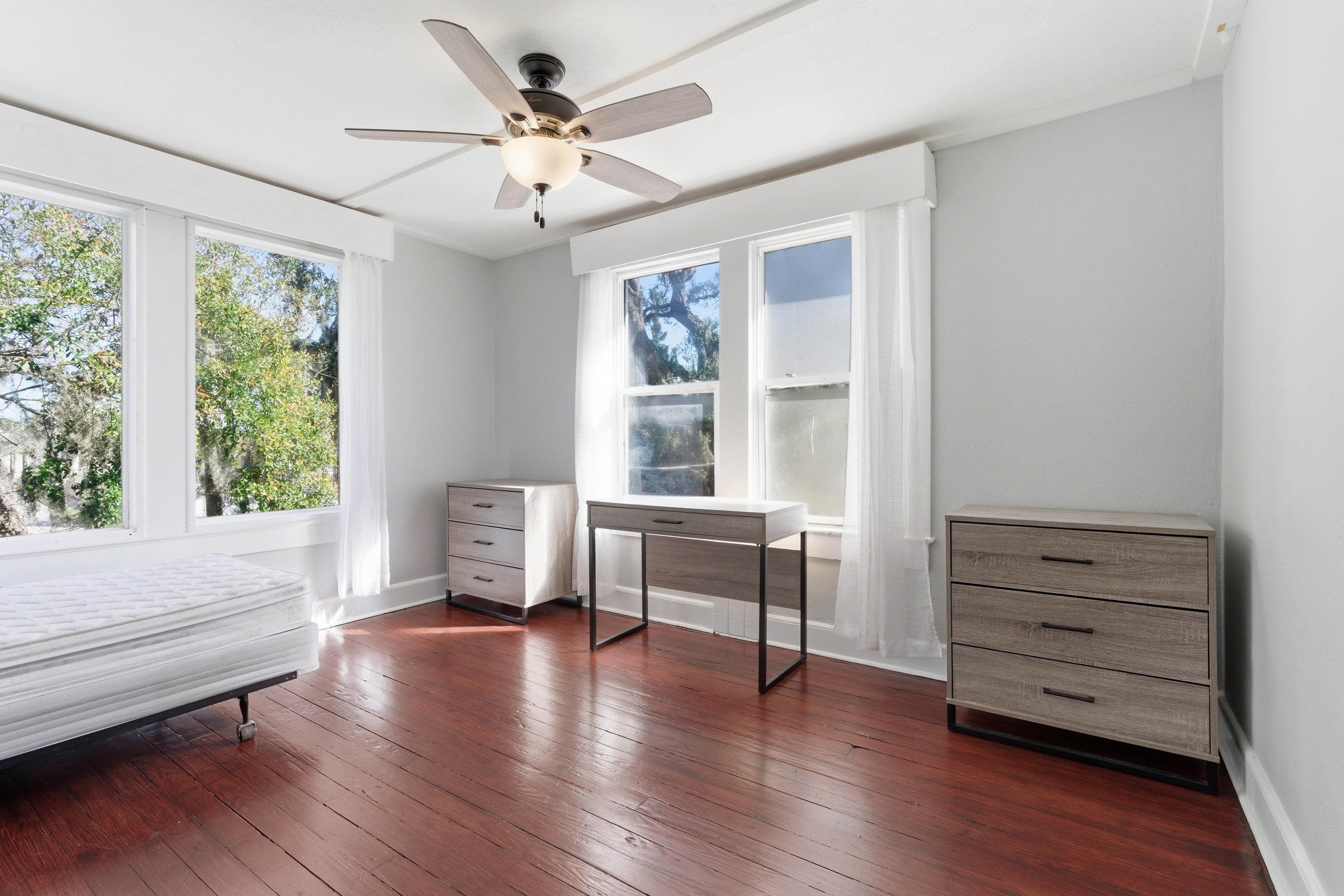 50 Saragossa Street, Unit D St. Augustine, FL 32084 - Photo 7 of 9 a living room with furniture and a window