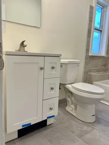 a bathroom with a toilet and a sink