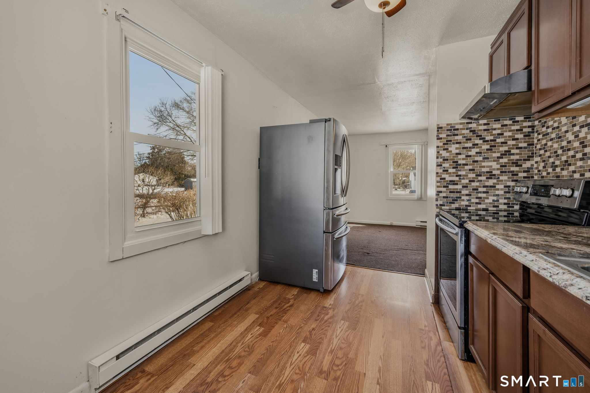 209 Midway Ovl Groton, CT 06340 - Photo 16 of 31 a kitchen with stainless steel appliances granite countertop a refrigerator and a sink