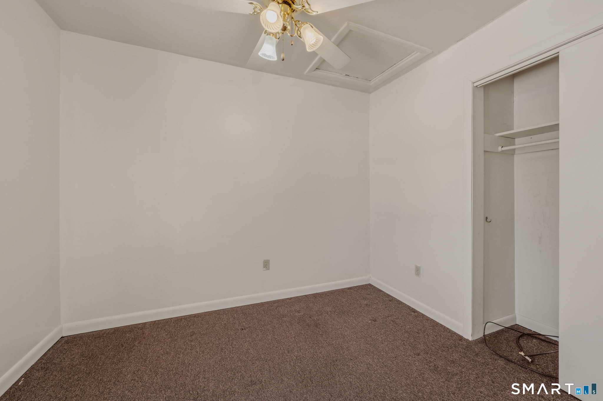 209 Midway Ovl Groton, CT 06340 - Photo 17 of 31 an empty room with a ceiling fan and window