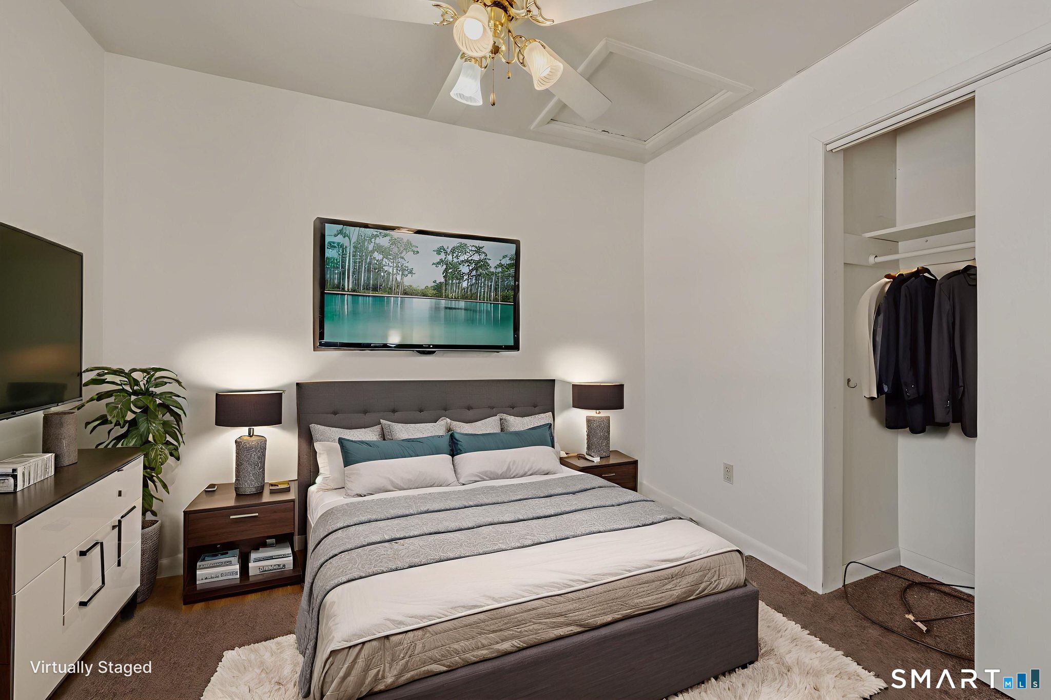 209 Midway Ovl Groton, CT 06340 - Photo 18 of 31 a bedroom with a bed and a flat screen tv