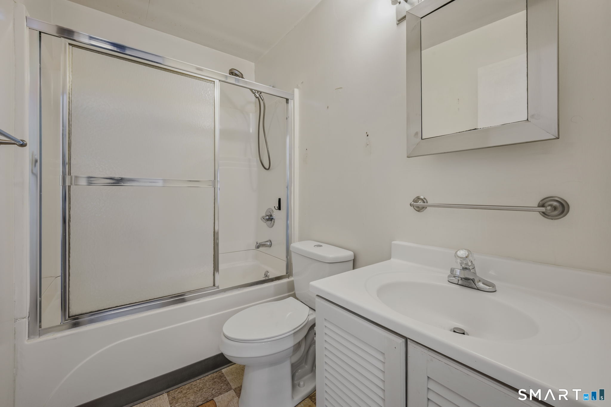 209 Midway Ovl Groton, CT 06340 - Photo 20 of 31 a bathroom with a sink a toilet and shower