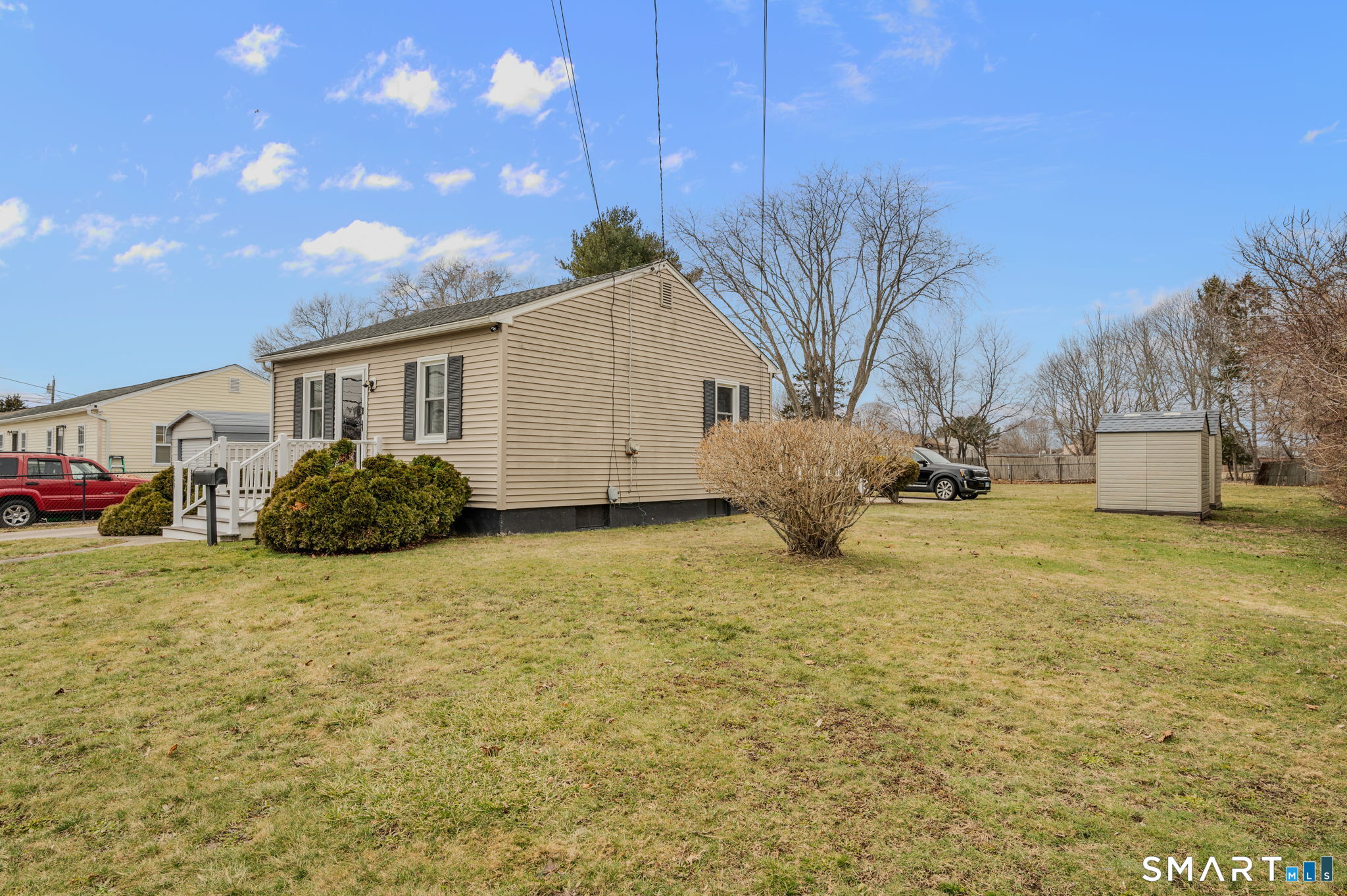 209 Midway Ovl Groton, CT 06340 - Photo 29 of 31 a view of a house with a yard