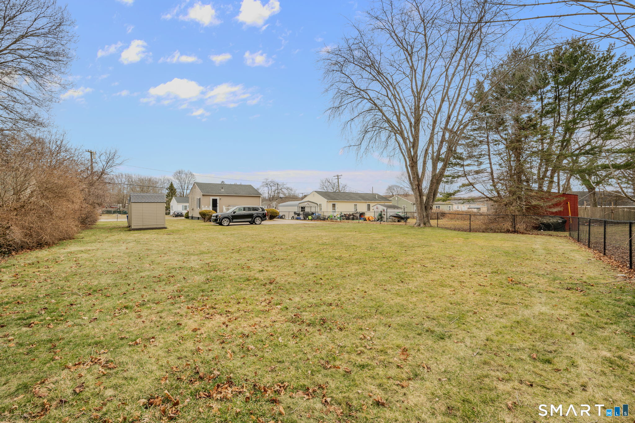 209 Midway Ovl Groton, CT 06340 - Photo 30 of 31 a yard with tall trees