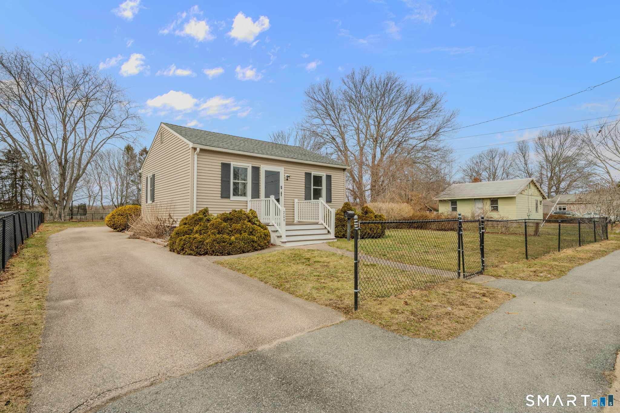 209 Midway Ovl Groton, CT 06340 - Photo 6 of 31 a house with yard covered in snow