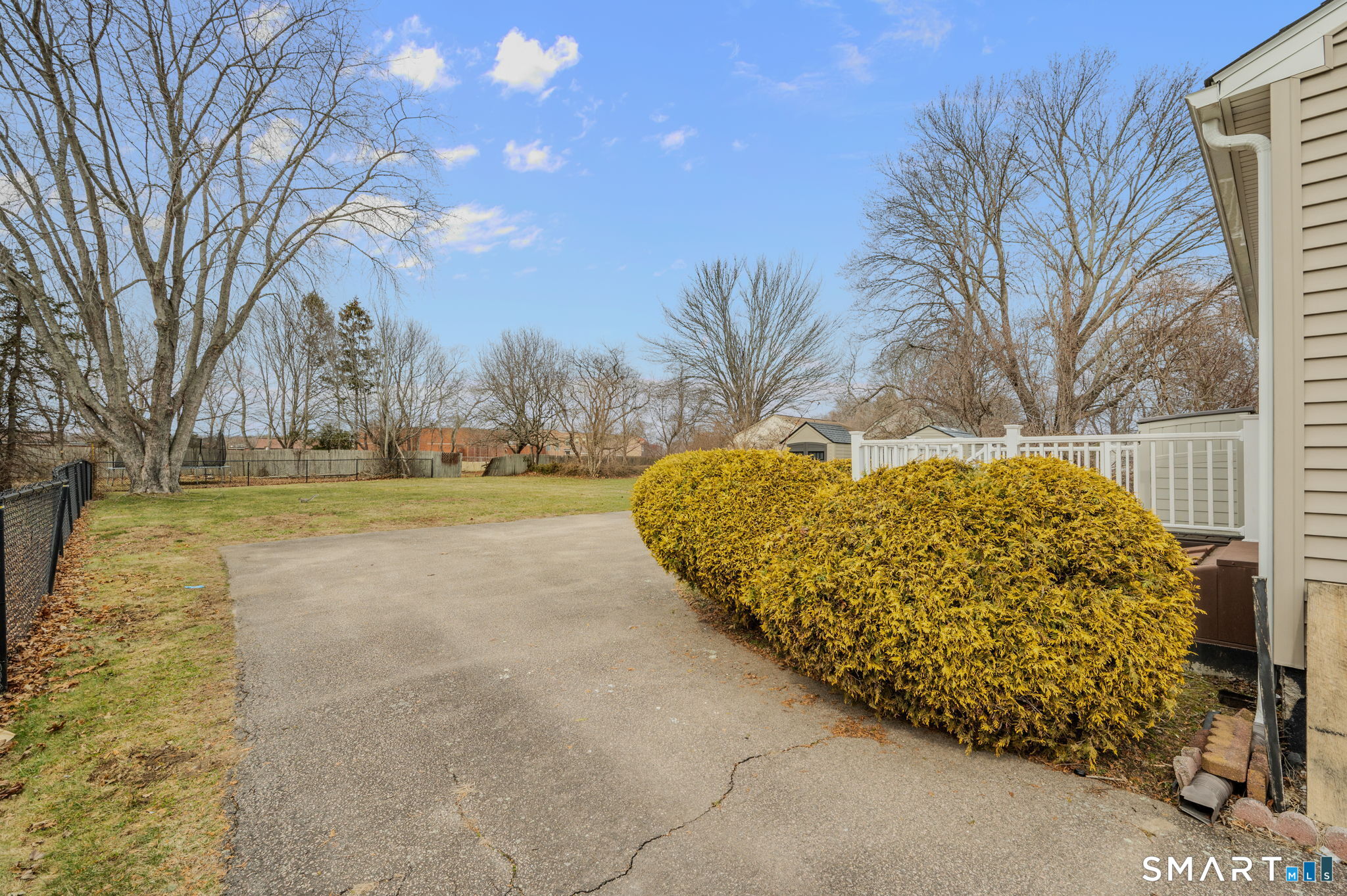 209 Midway Ovl Groton, CT 06340 - Photo 8 of 31 a view of backyard with tree
