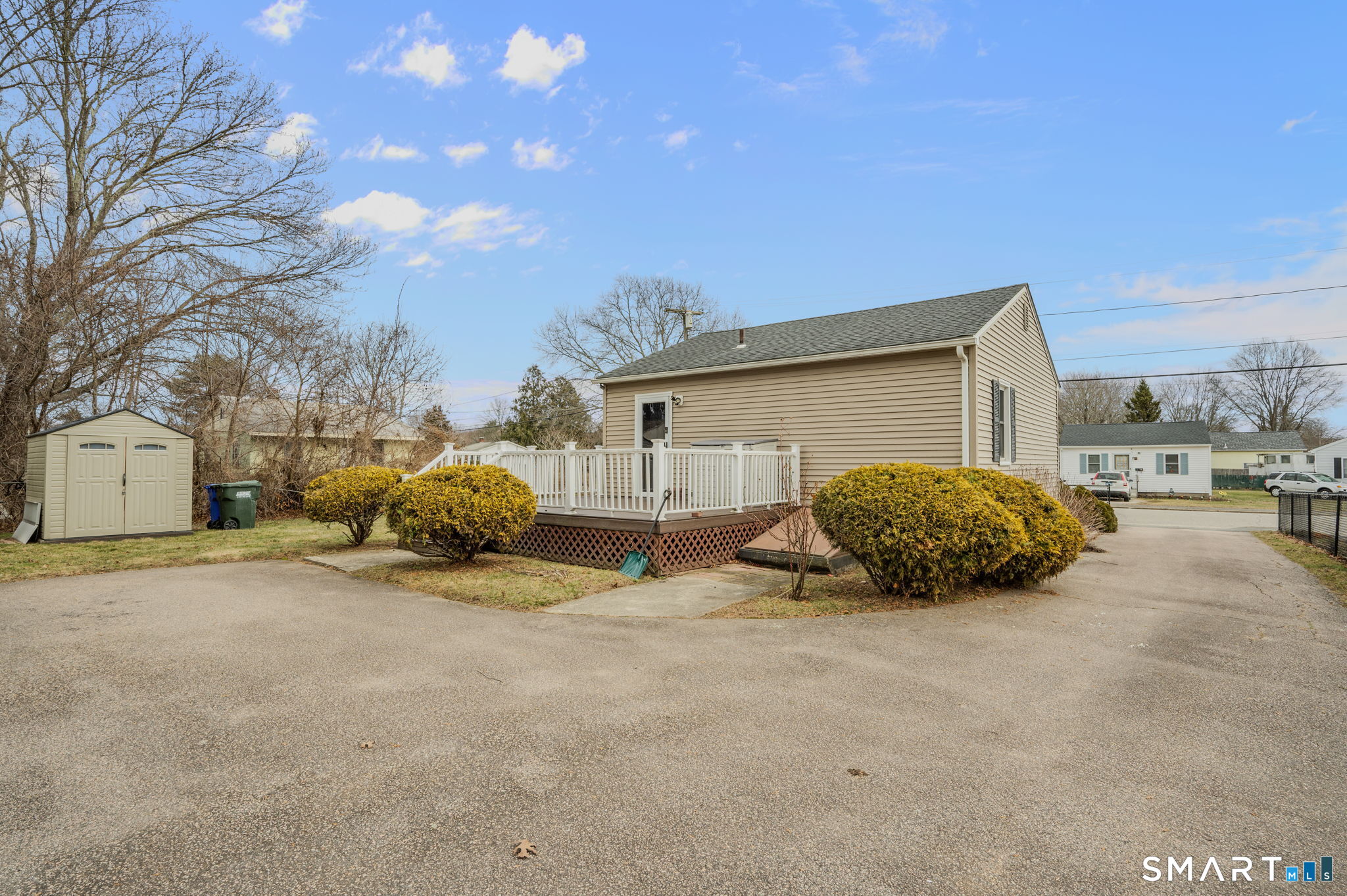 209 Midway Ovl Groton, CT 06340 - Photo 9 of 31 a view of a house with a yard and garage