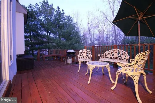 a view of a chairs and table on the wooden floor