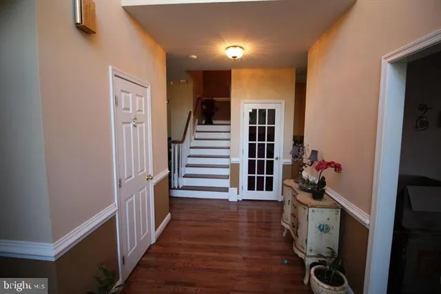 a view of entryway with wooden floor