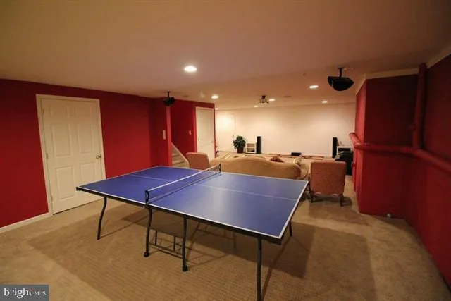 a view of a room with furniture and a potted plant