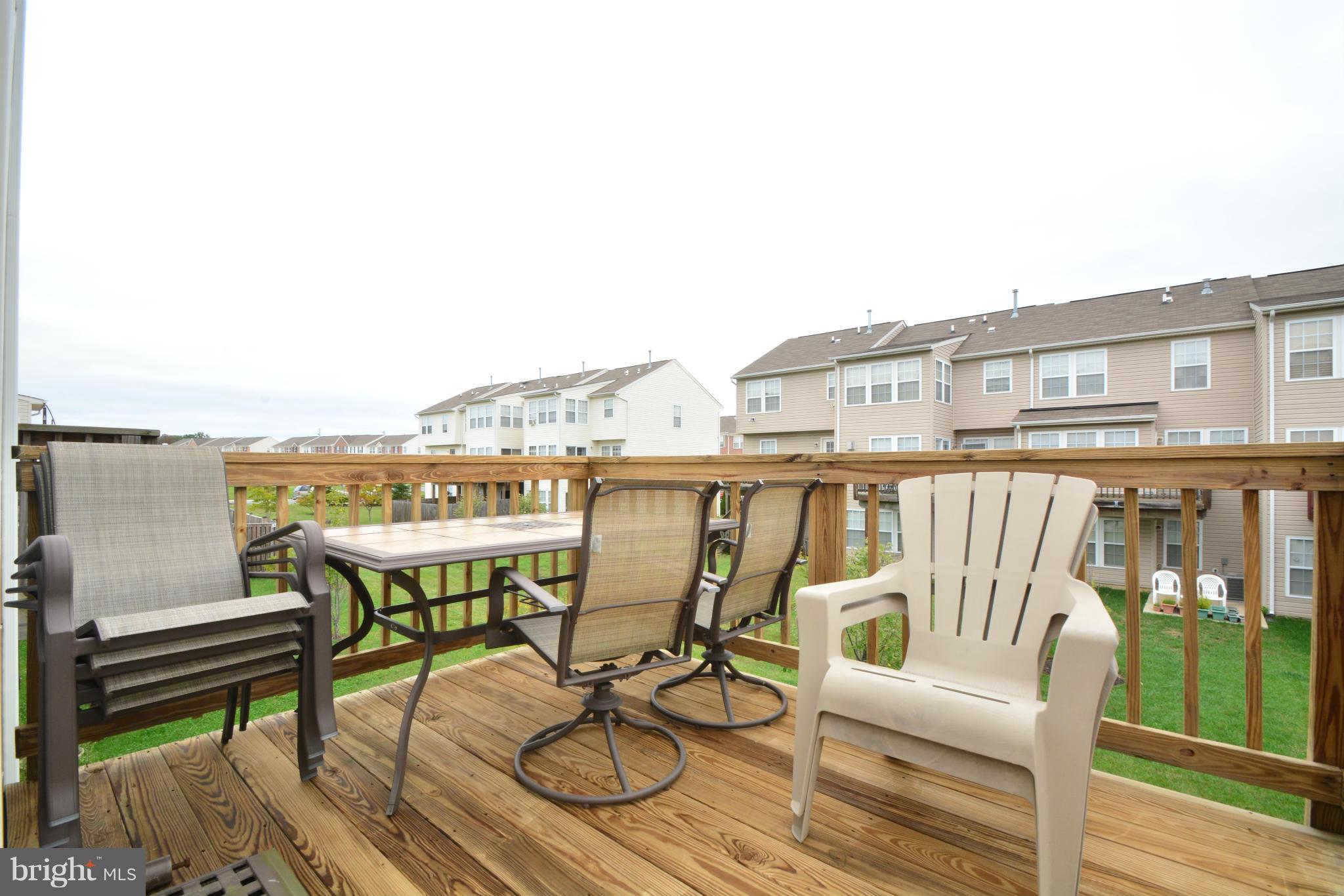 9705 Selfridge Road Baltimore, MD 21220 - Photo 16 of 30 a view of a chairs and table on the terrace
