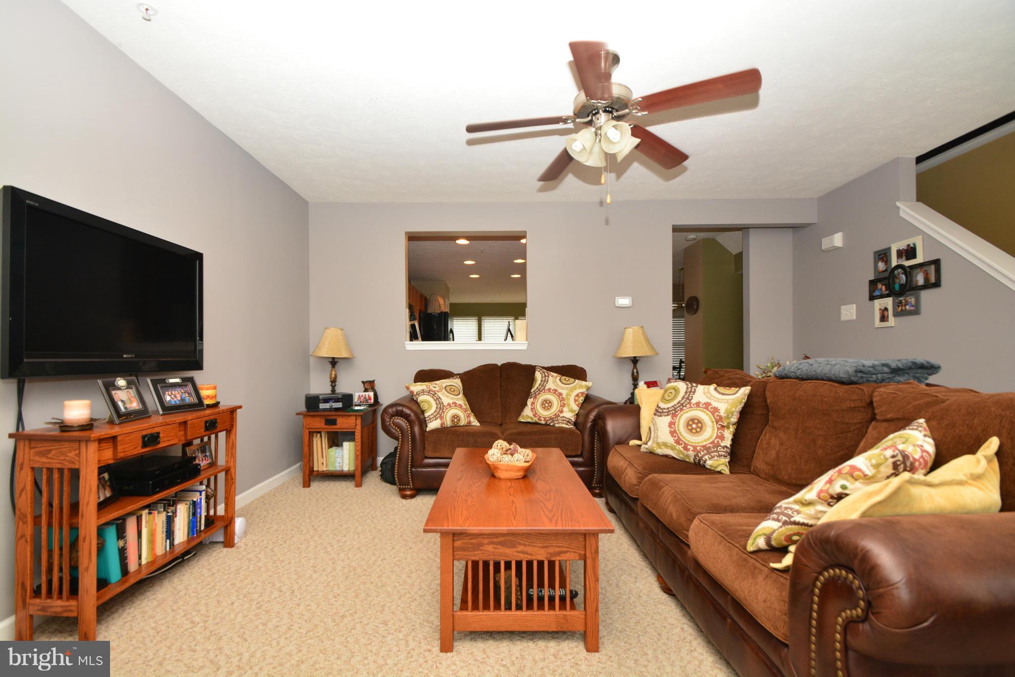 9705 Selfridge Road Baltimore, MD 21220 - Photo 17 of 30 a living room with furniture and a flat screen tv