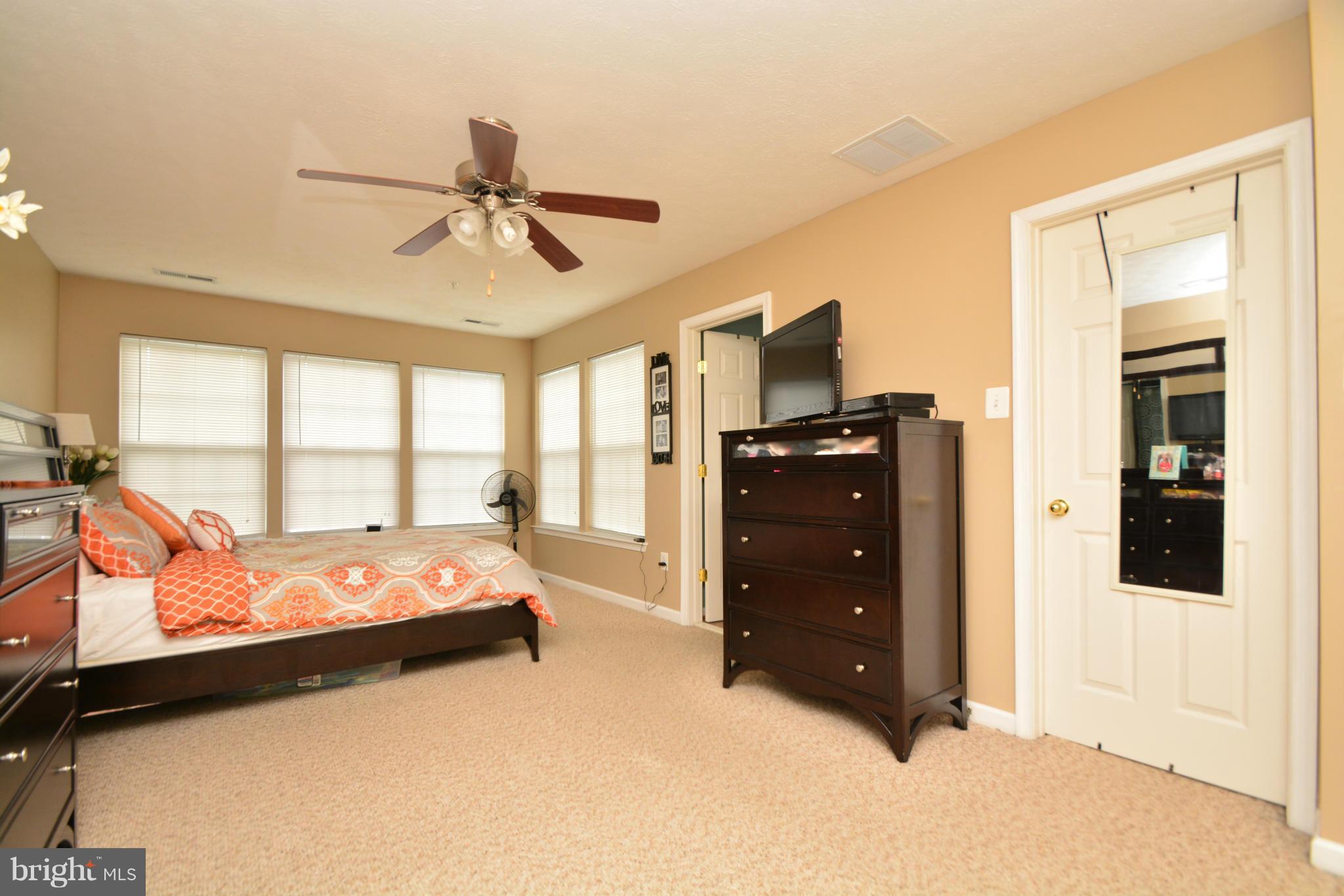 9705 Selfridge Road Baltimore, MD 21220 - Photo 22 of 30 a bed room with a bed and a window