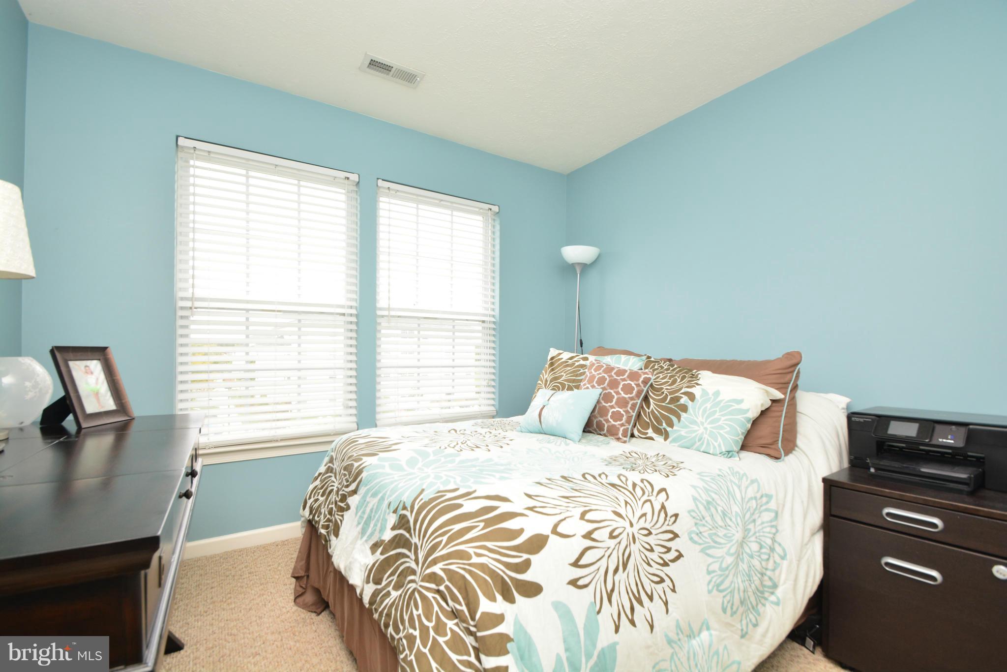 9705 Selfridge Road Baltimore, MD 21220 - Photo 25 of 30 a bedroom with a bed and a window