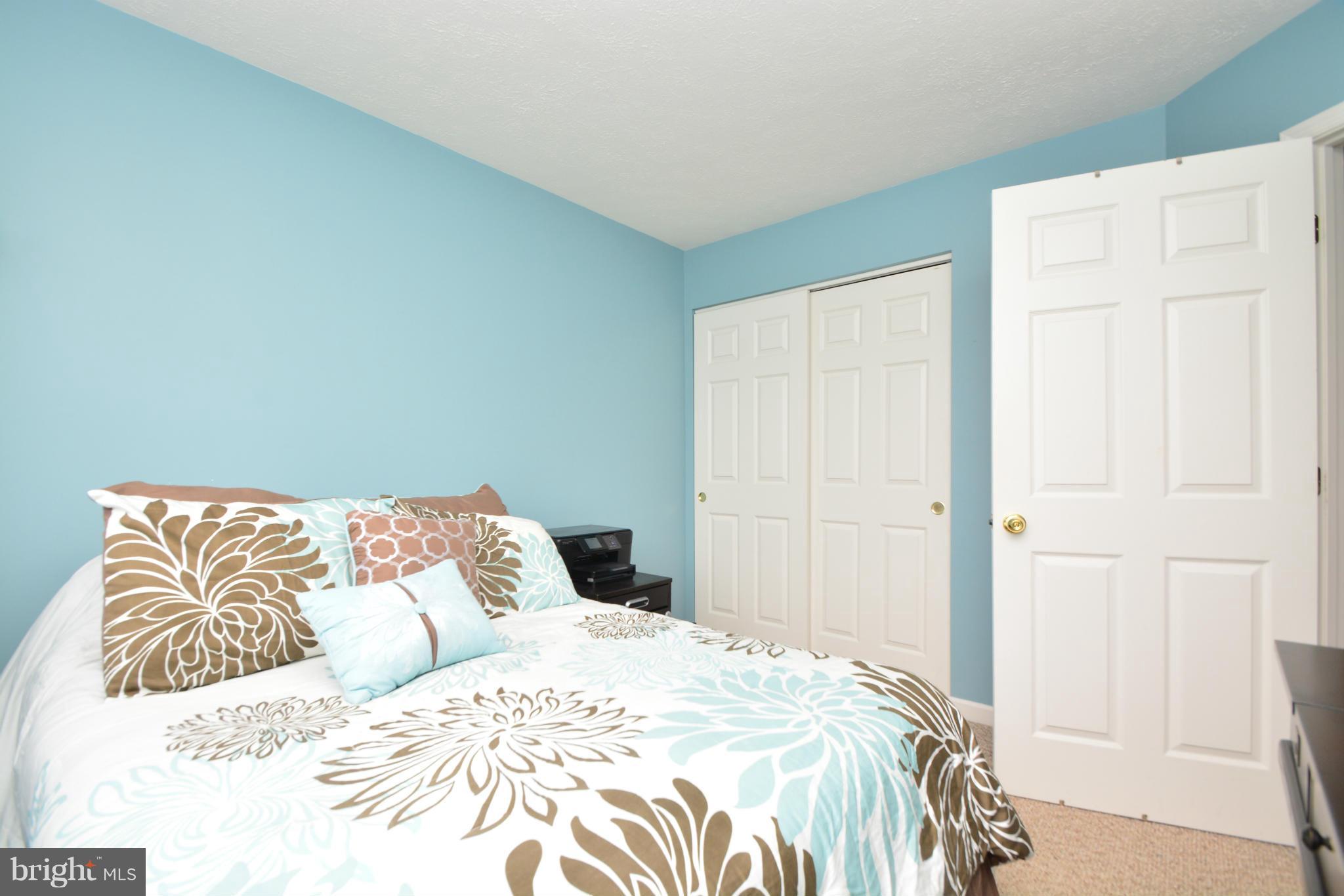 9705 Selfridge Road Baltimore, MD 21220 - Photo 26 of 30 a bedroom with a white bed and a white door