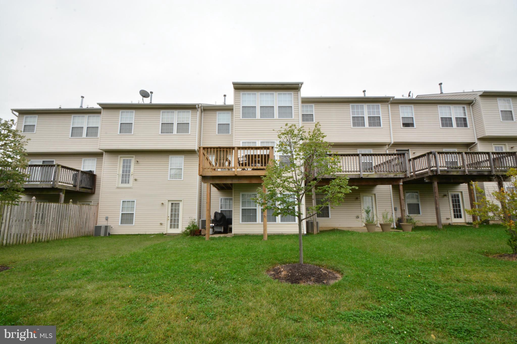 9705 Selfridge Road Baltimore, MD 21220 - Photo 30 of 30 a view of a house with backyard and deck