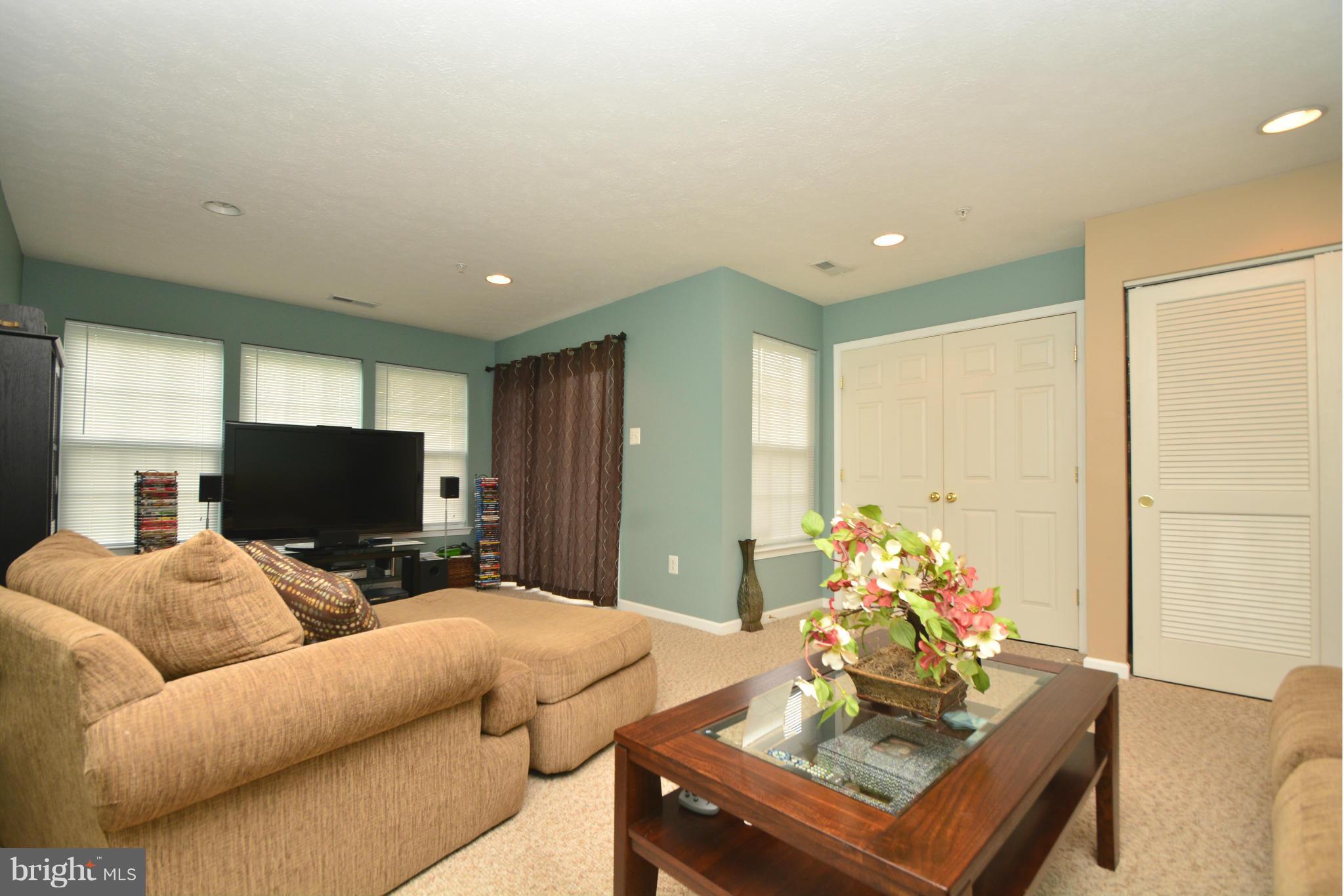 9705 Selfridge Road Baltimore, MD 21220 - Photo 4 of 30 a living room with furniture and a flat screen tv