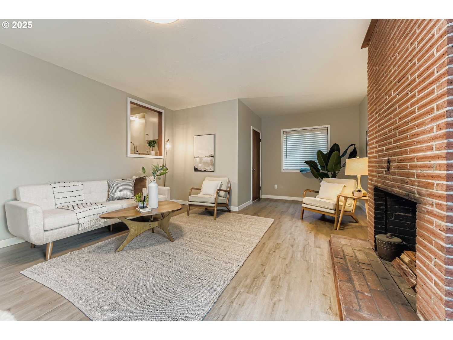 2728 Southeast 175th Place Portland, OR 97236 - Photo 11 of 33 a living room with furniture and a fireplace