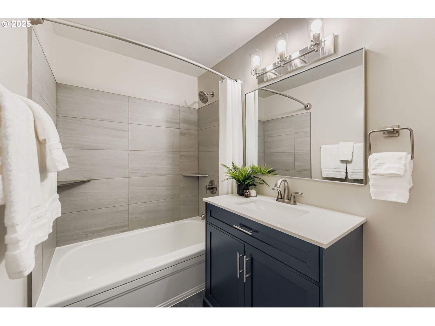2728 Southeast 175th Place Portland, OR 97236 - Photo 15 of 33 a bathroom with a sink vanity granite tub shower and a mirror