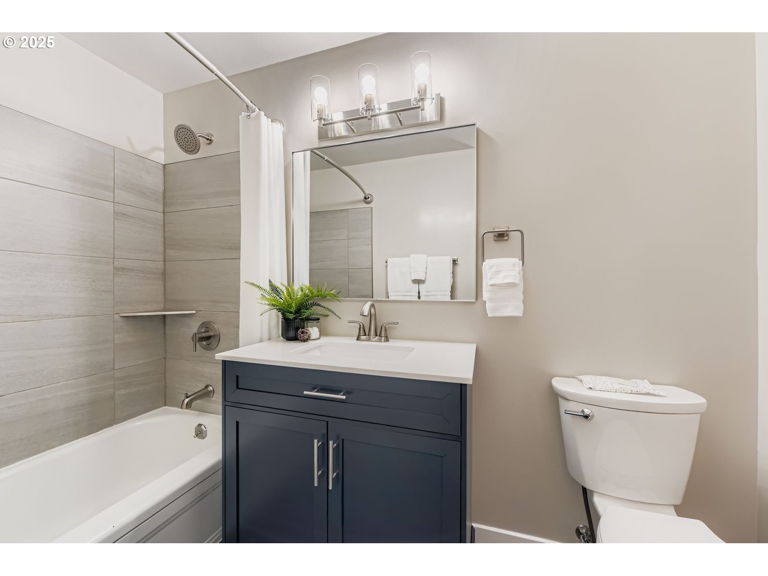 2728 Southeast 175th Place Portland, OR 97236 - Photo 16 of 33 a bathroom with a sink a toilet a mirror and shower