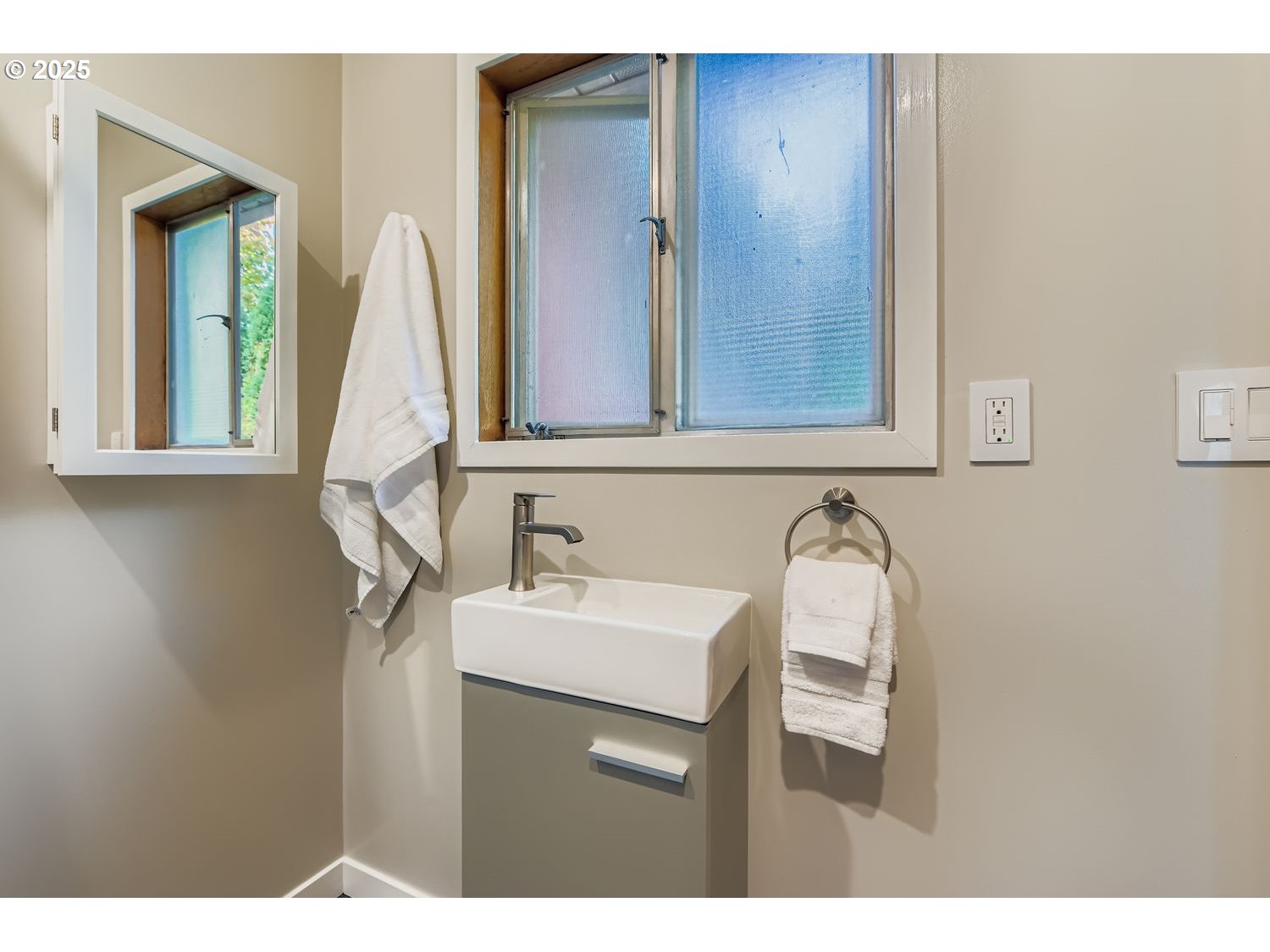 2728 Southeast 175th Place Portland, OR 97236 - Photo 20 of 33 a bathroom with a sink and a mirror