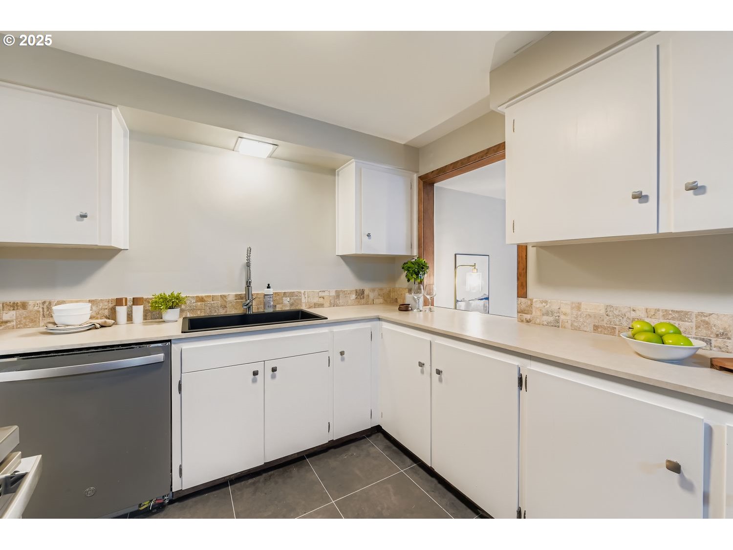 2728 Southeast 175th Place Portland, OR 97236 - Photo 22 of 33 a kitchen with granite countertop a sink and cabinets