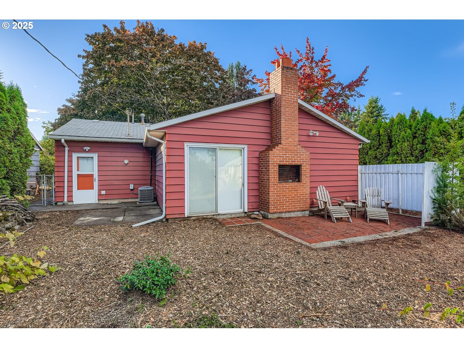 2728 Southeast 175th Place Portland, OR 97236 - Photo 26 of 33 a backyard of a house with table and chairs