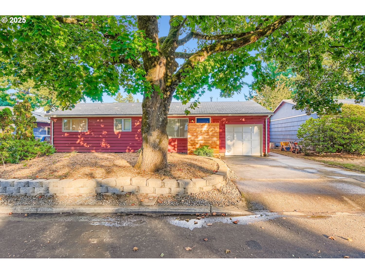 2728 Southeast 175th Place Portland, OR 97236 - Photo 27 of 33 a front view of a house with garden