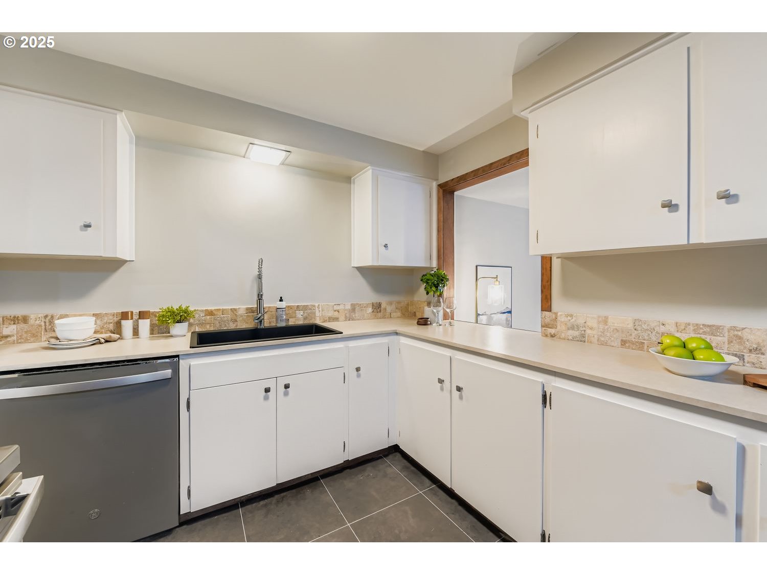 2728 Southeast 175th Place Portland, OR 97236 - Photo 6 of 33 a kitchen with granite countertop a sink and cabinets