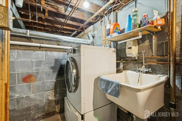 a bathroom with a sink and mirror
