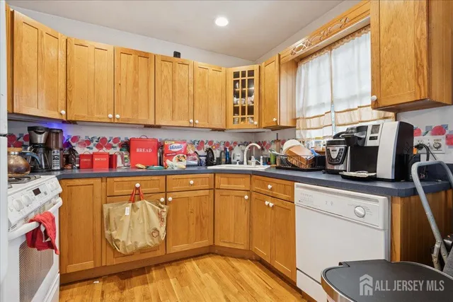 a kitchen with a sink cabinets and appliances
