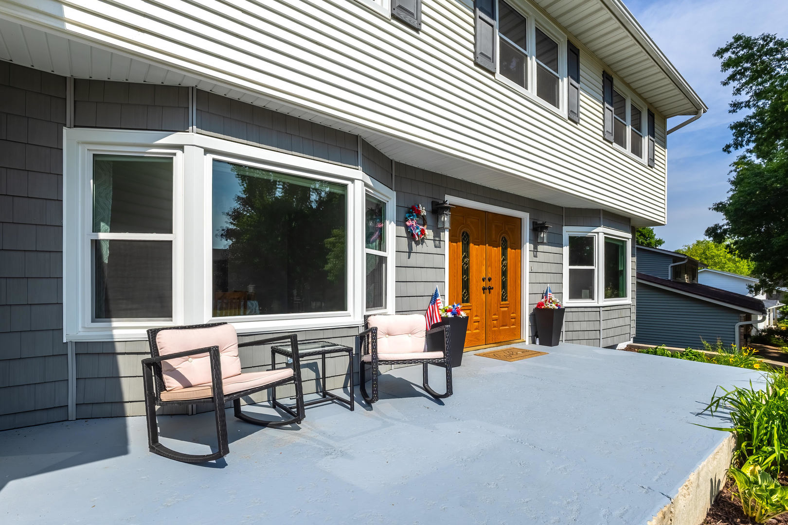4314 Spring Street Davenport, IA 52807 - Photo 4 of 51 a building outdoor space with patio furniture and potted plants