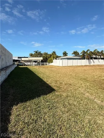 a view of a street sign under a large tree