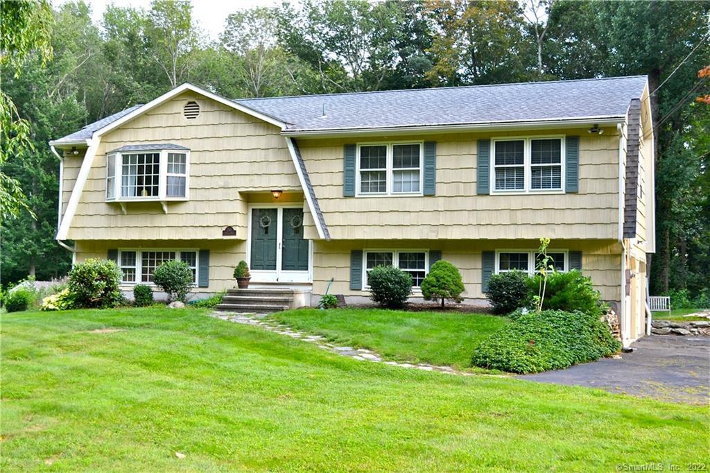 250 Shelton Road Monroe, CT 06468 - Photo 1 of 1 a front view of a house with a yard
