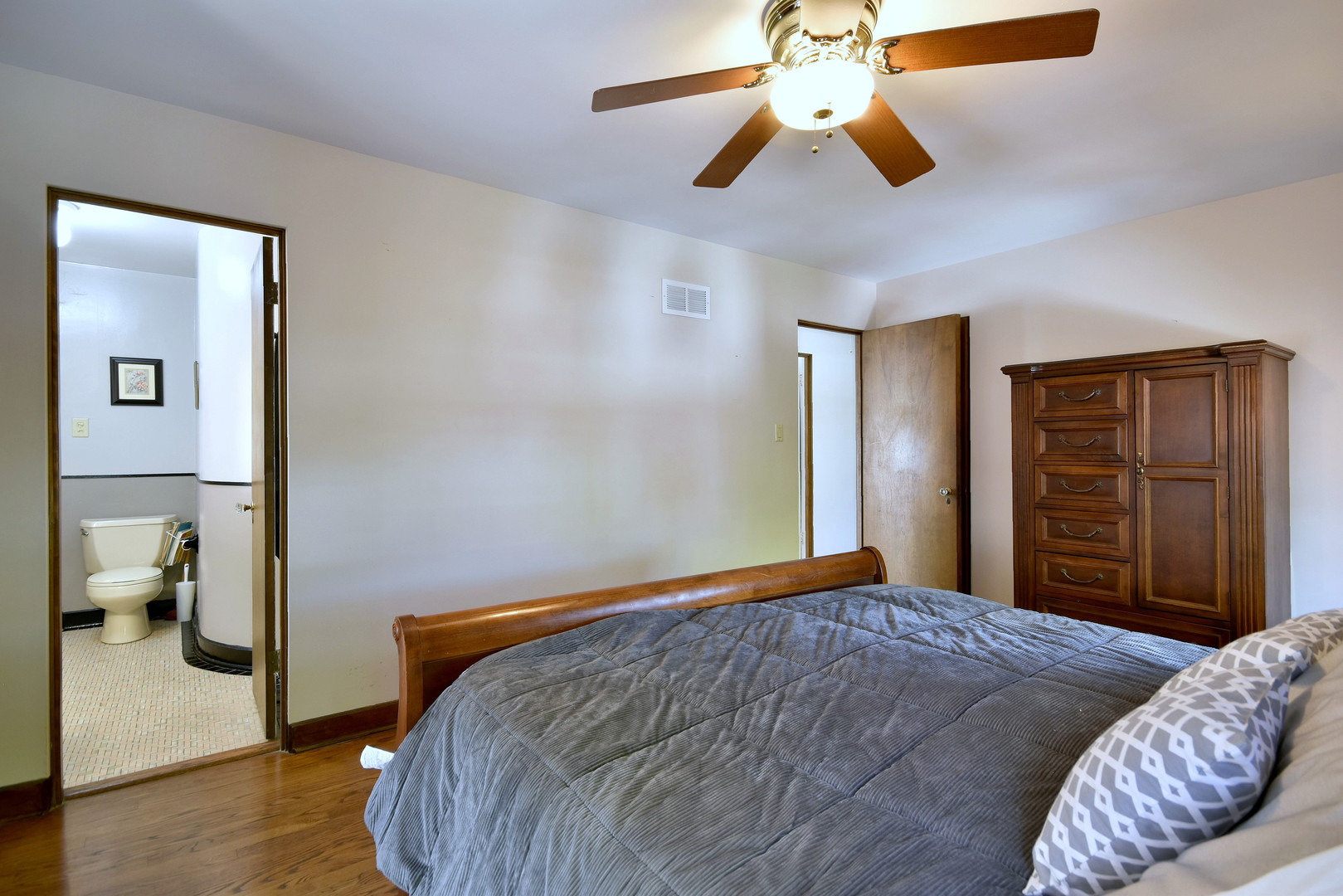 196 Fairfield Avenue Elmhurst, IL 60126 - Photo 21 of 44 a bedroom with a bed and a chandelier