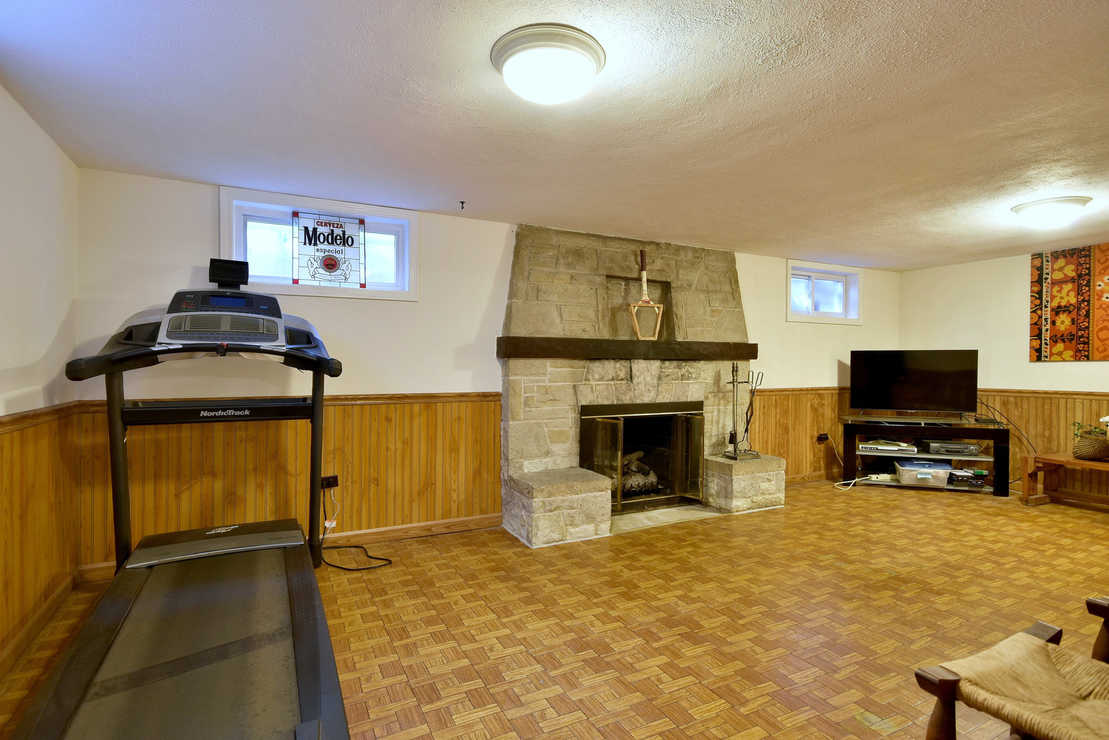 196 Fairfield Avenue Elmhurst, IL 60126 - Photo 31 of 44 a living room with furniture and a flat screen tv