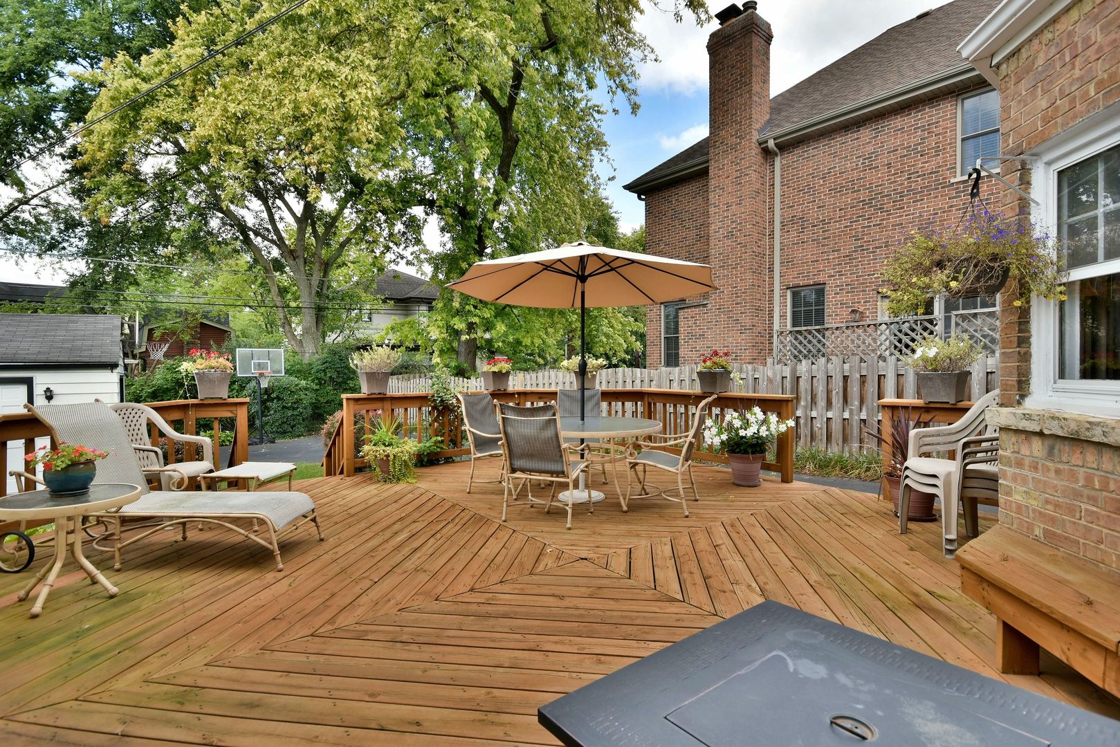 196 Fairfield Avenue Elmhurst, IL 60126 - Photo 44 of 44 a view of a patio with table and chairs under an umbrella with a barbeque