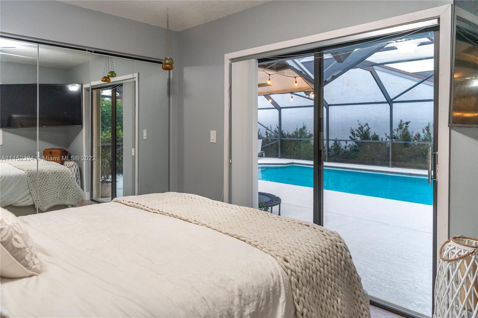21356 Summertrace Circle Boca Raton, FL 33428 - Photo 11 of 21 a bedroom with a bed and a large window with outer view