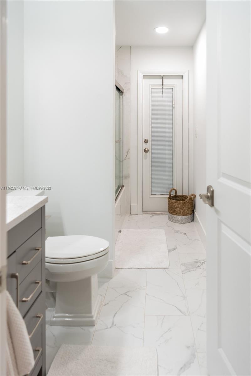 21356 Summertrace Circle Boca Raton, FL 33428 - Photo 13 of 21 a bathroom with a toilet a sink and shower