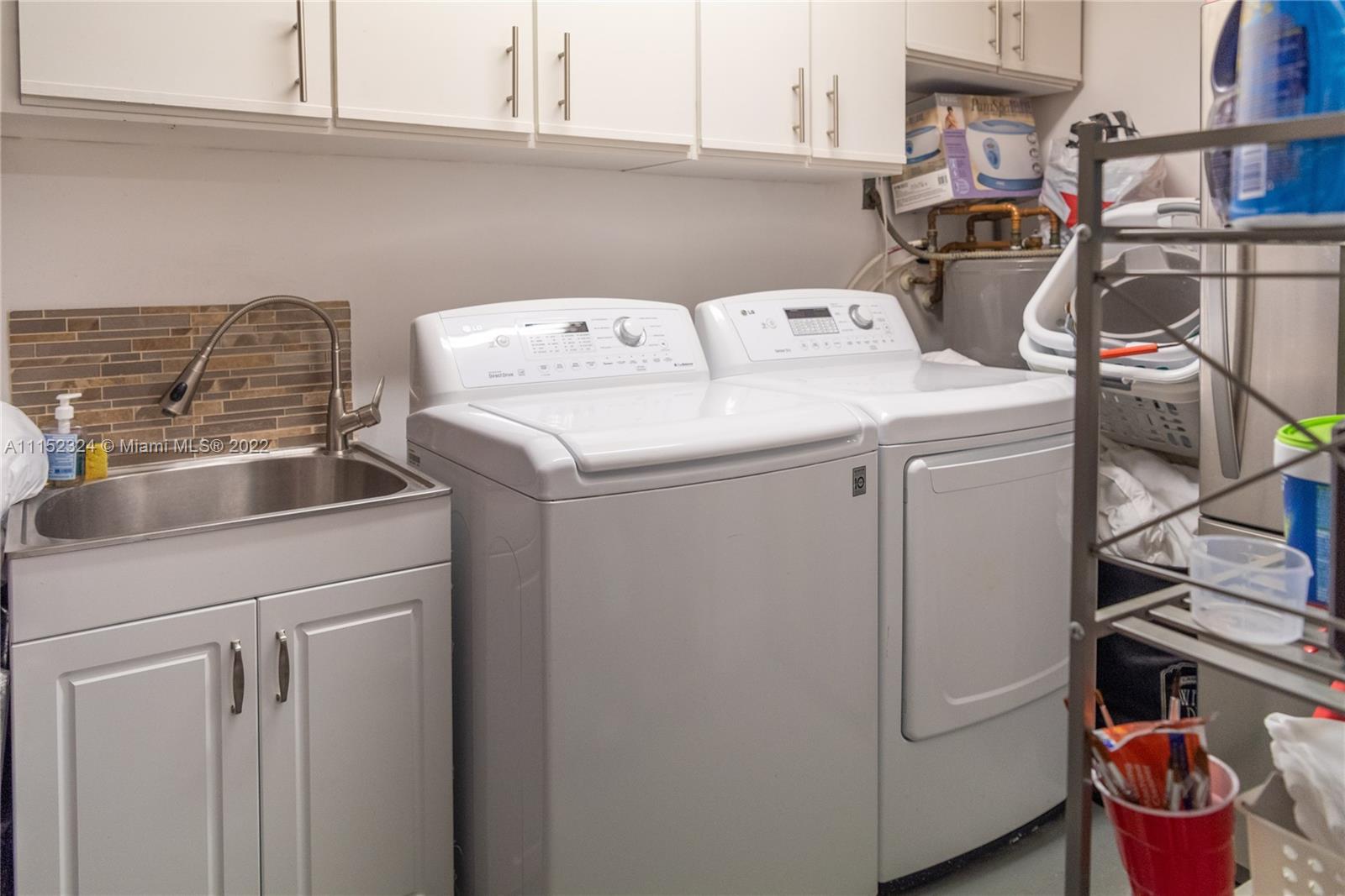 21356 Summertrace Circle Boca Raton, FL 33428 - Photo 20 of 21 a utility room with dryer and washer