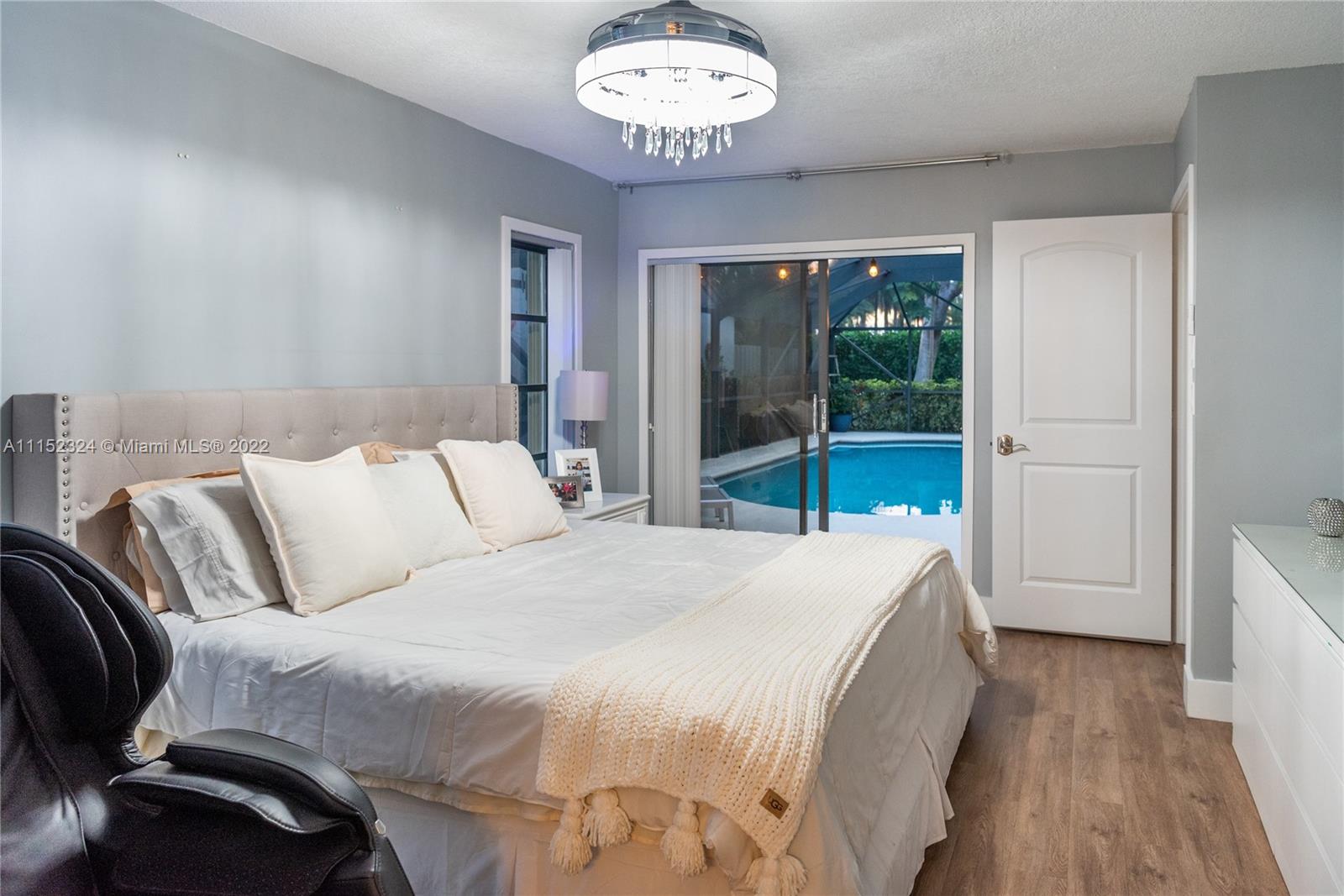 21356 Summertrace Circle Boca Raton, FL 33428 - Photo 6 of 21 a spacious bedroom with a bed and a large window