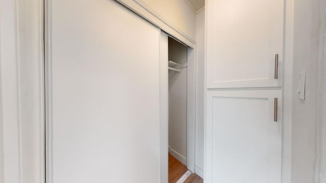 a utility room with cabinets washer and dryer